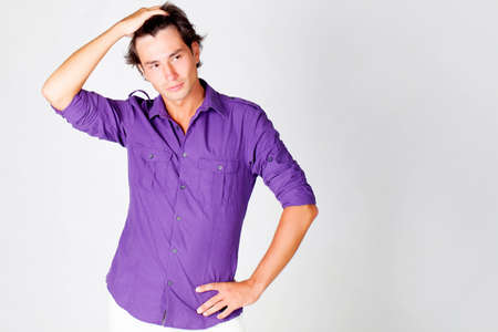 Young man studio portrait isolated on whiteの写真素材