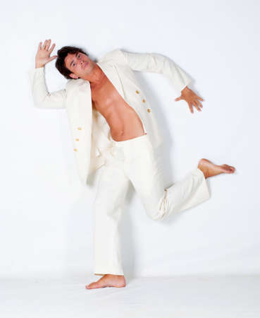 Young man posing in studio isolated on whiteの写真素材