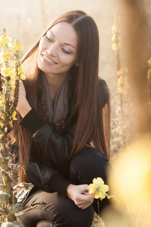 Beautiful young woman on the meadowの写真素材