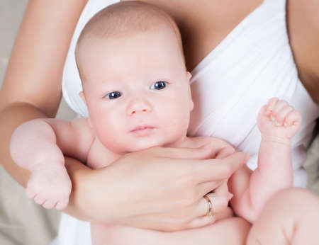 Infant boy and mother handの写真素材