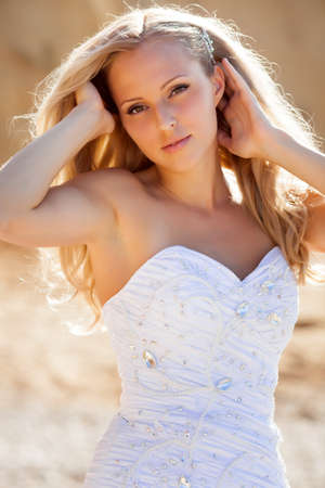 Beautiful bride portrait near the wallの写真素材