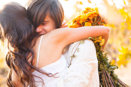 Two lovers on picnic in peach gardenの写真素材