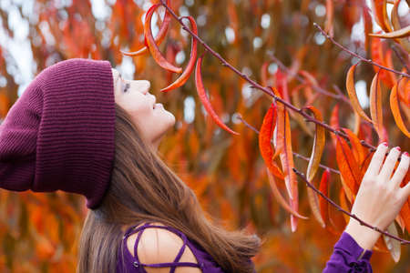 Beautiful woman portrait in autunm gardenの写真素材