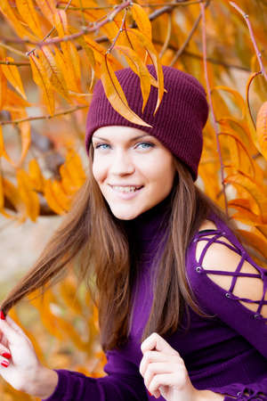 Beautiful woman portrait in autunm gardenの写真素材
