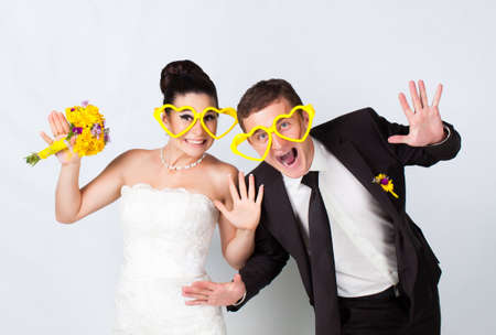 Bride and groom portrait with glassesの写真素材