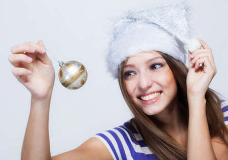 Beautiful girl with toy christmas ball の写真素材