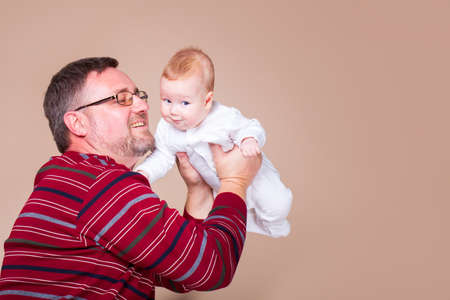 Father holding little boy in handsの写真素材