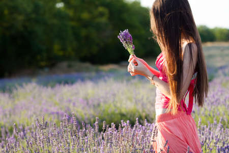 Beautiful girl on the lavender fieldの写真素材