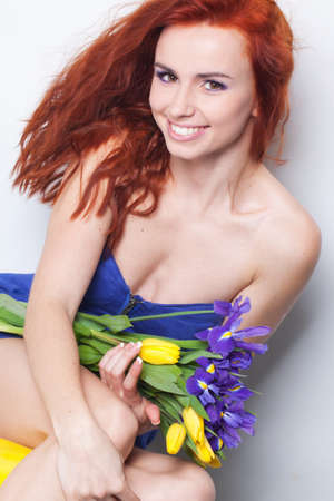 Beautiful girl with tulip flowersの写真素材