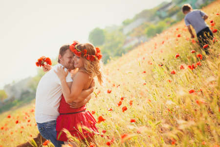 Two lovers on the poppy meadowの写真素材