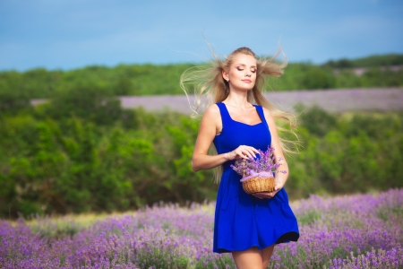 Blond girl with long hair on lavender fieldの写真素材