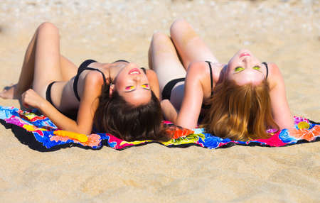 Two girlfriends on the beachの写真素材