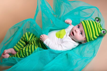 Little boy lying in studioの写真素材