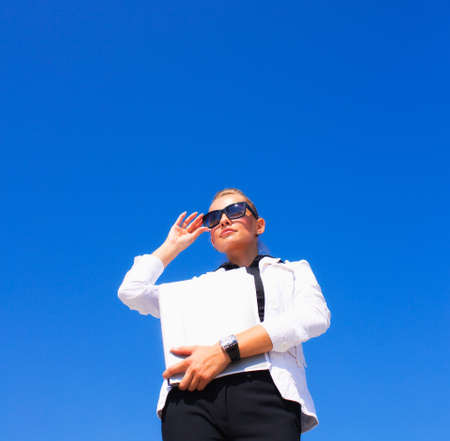 Business women with stack of papersの写真素材