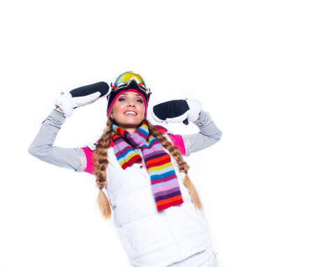 Young beautiful woman in winter sport clothes isolated on whiteの写真素材