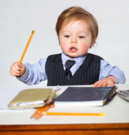 Little businessman portrait in officeの写真素材