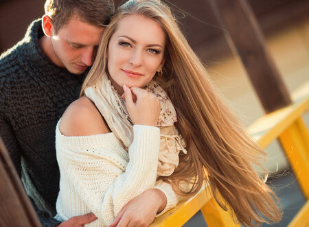 Two lovers on the autumn streetの写真素材