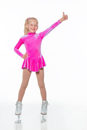 Little beautiful girl portrait in skates on the iceの写真素材