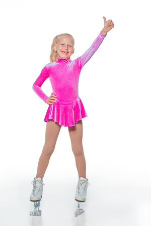 Little beautiful girl portrait in skates on the iceの写真素材