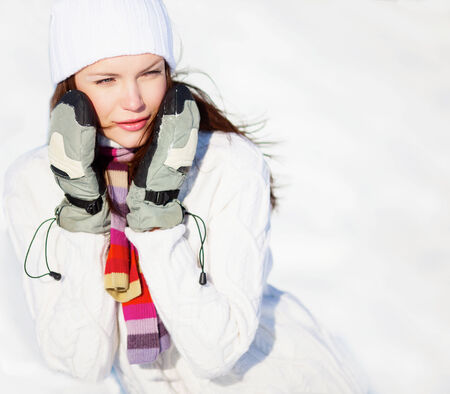 Girl playing with snow in parkの写真素材