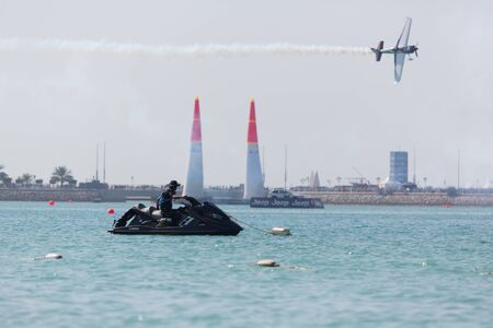 ABU-DHABI, UNITED ARABIAN EMIRATES - FEBRUARY 14 . Lifeguard sitting on jetski at the stage of redbull airrace competition on february 14, 2015 in Abu-Dhabi, United Arabian Emiratesのeditorial素材