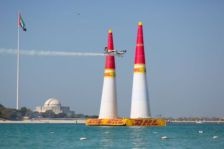 ABU-DHABI, UNITED ARABIAN EMIRATES - FEBRUARY 14 . Racing airplane at the stage of redbull airrace competition on february 14, 2015 in Abu-Dhabi, United Arabian Emiratesのeditorial素材