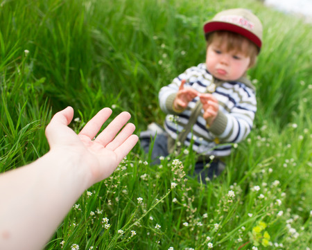 Mother giving hand to the sonの写真素材