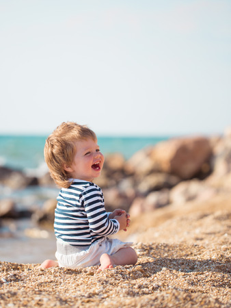 Little boy on the beachの写真素材