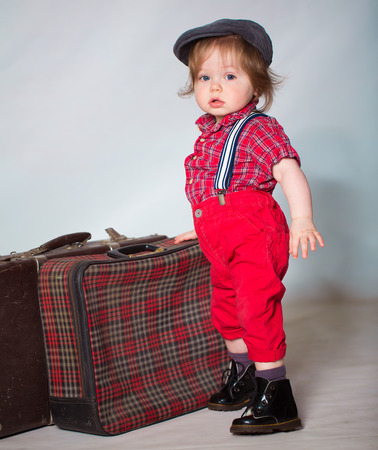 Little boy photo with suitcaseの写真素材