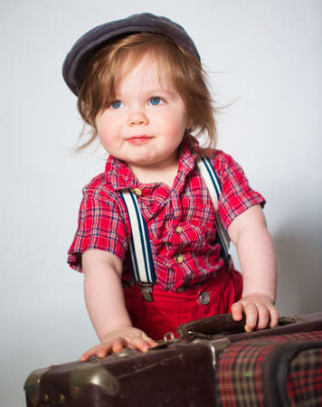 Little boy photo with suitcaseの写真素材