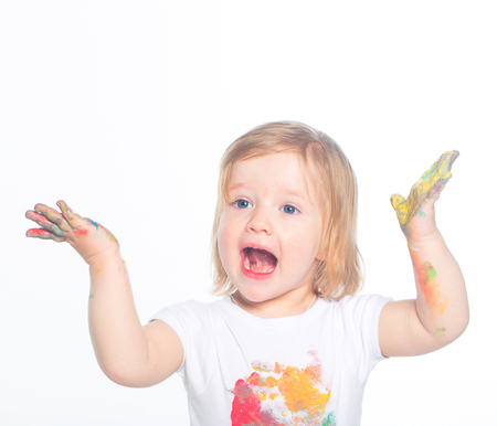 Little girl playing with paintsの写真素材