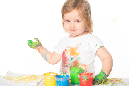 Little girl playing with paintsの写真素材