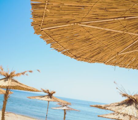 Beach umbrellas on exotic tropical white sand beachの写真素材