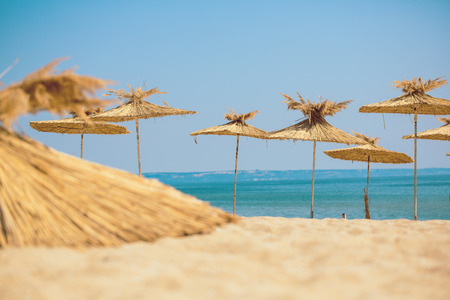 Beach umbrellas on exotic tropical white sand beachの写真素材