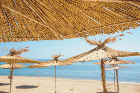 Beach umbrellas on exotic tropical white sand beachの写真素材