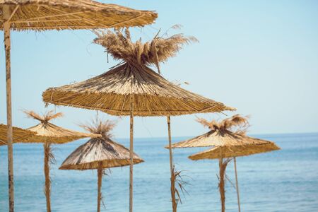 Beach umbrellas on exotic tropical white sand beachの写真素材