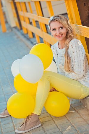 Young beautiful woman with balloonsの写真素材