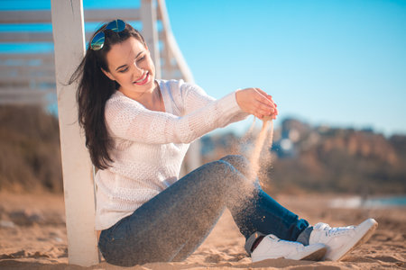 Beautiful girl lying on the beachの写真素材