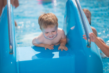 Child playing in swimming poolの写真素材