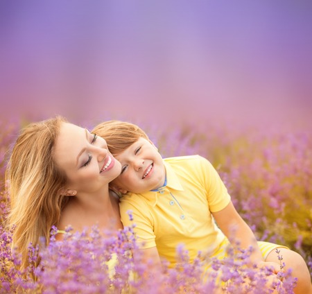 Happy Mother with son on lavender fieldの写真素材