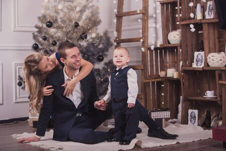 Family prepearing for christmas holidays at homeの写真素材