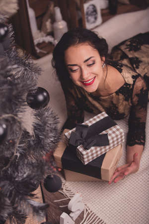 Young beautiful woman waiting christmas at homeの写真素材