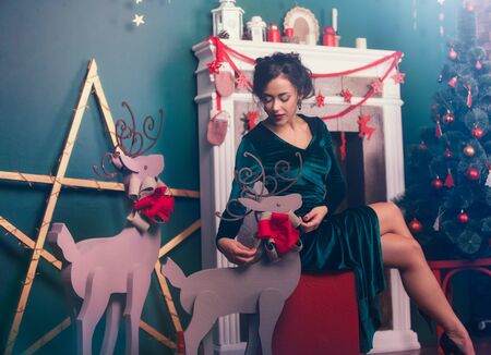Beautiful beautiful woman preparing for christmas holidaysの写真素材