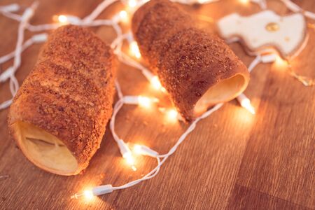 Traditional Slovak cake Trdelnik photo with christmas garlandの写真素材