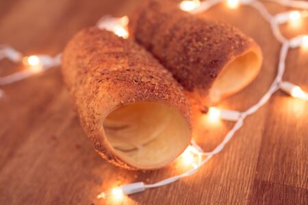 Traditional Slovak cake Trdelnik photo with christmas garlandの写真素材