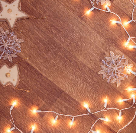 Backgroung of christmas garland lights on the wooden floorの写真素材