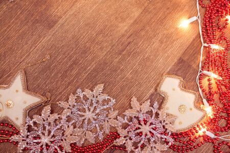 Backgroung of christmas garland lights on the wooden floorの写真素材