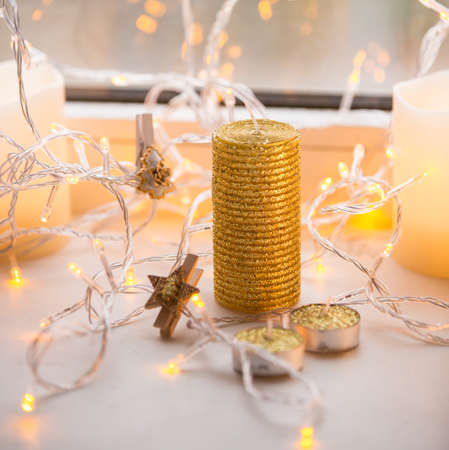 Decoration xmas gold color light garland with woodern pin on itの写真素材