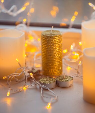 Decoration xmas gold color light garland with woodern pin on itの写真素材