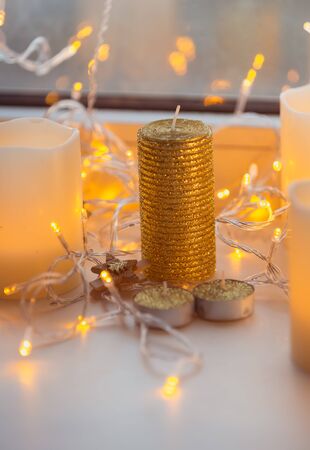 Decoration xmas gold color light garland with woodern pin on itの写真素材